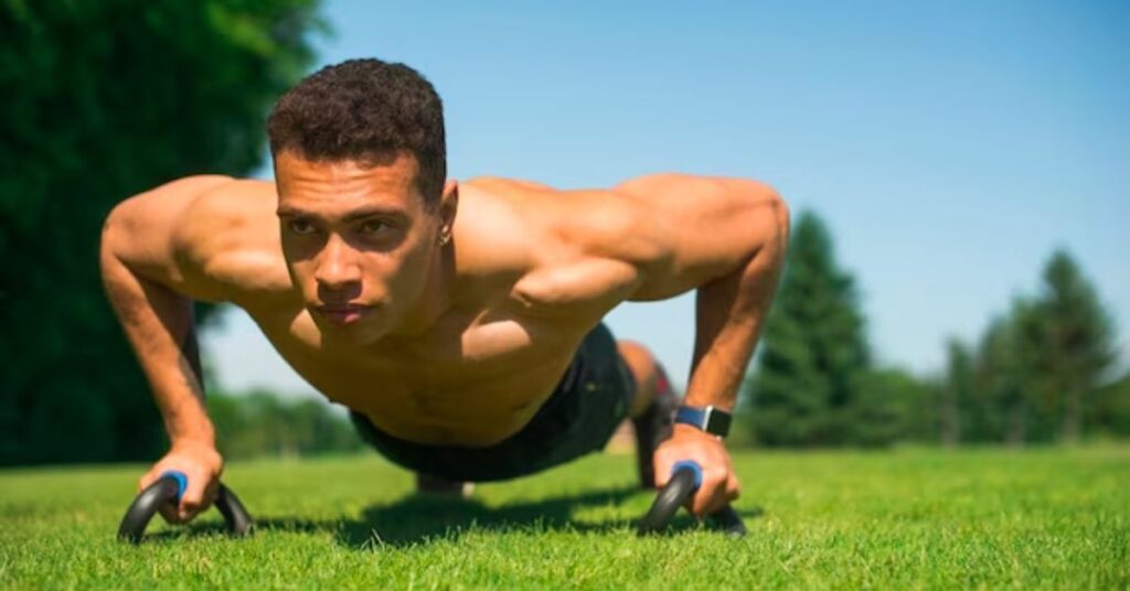 a man doing push ups in a ground