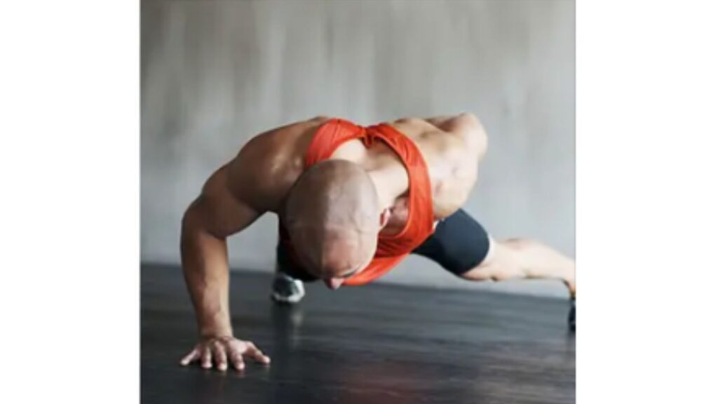 a man performing a one arm push ups