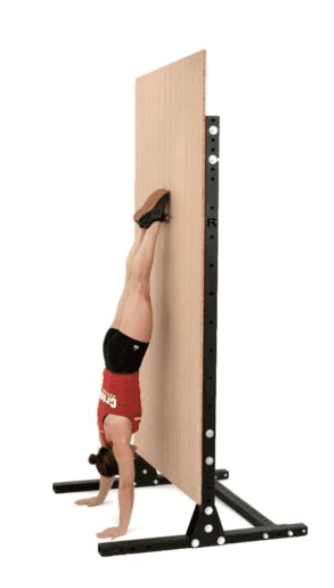 a lady back to the position for handstand push ups