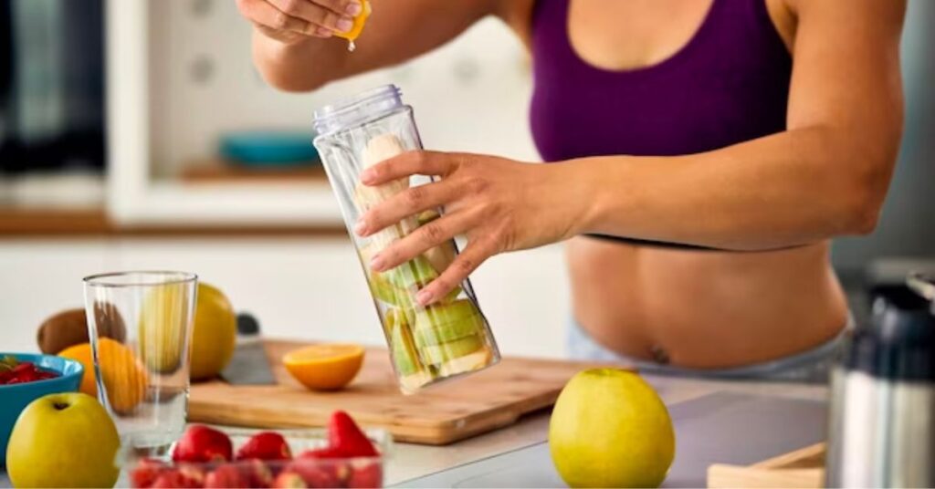 a lady preparing her post workout drink 