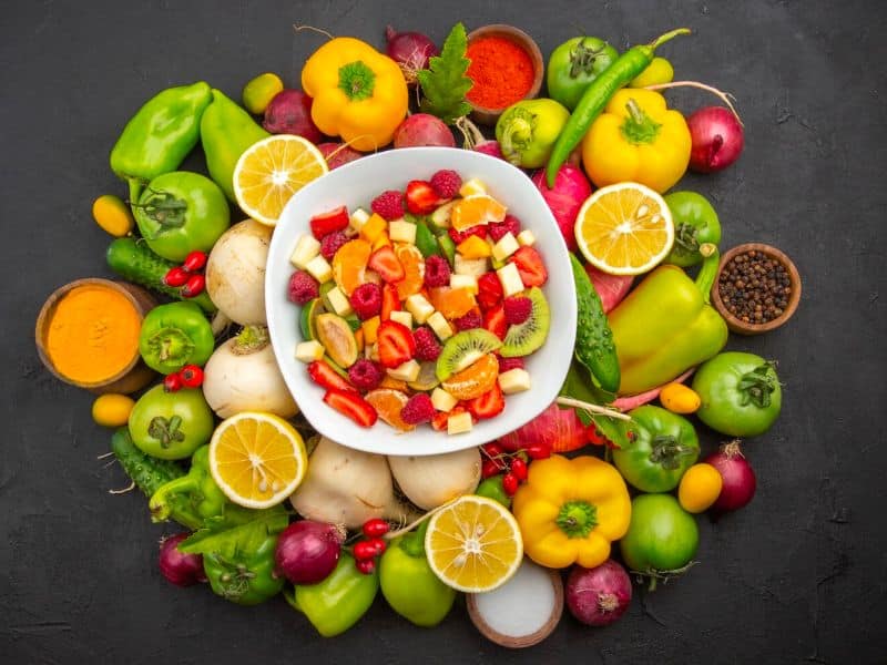 a plate full of healthy fruits and veggies 