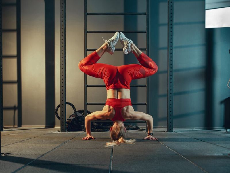 a lady doing upside down exercise 