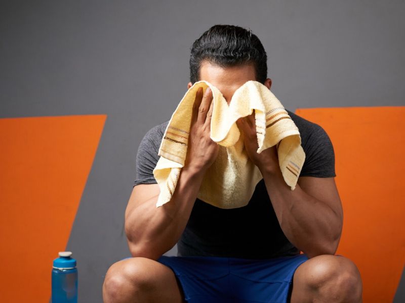 a man wiping off the sweat 