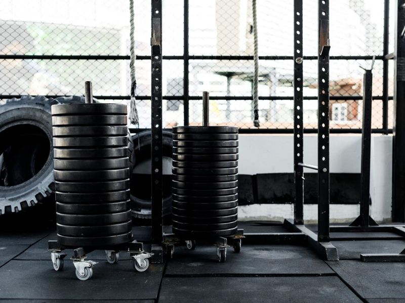 a gym room with weighted plates 