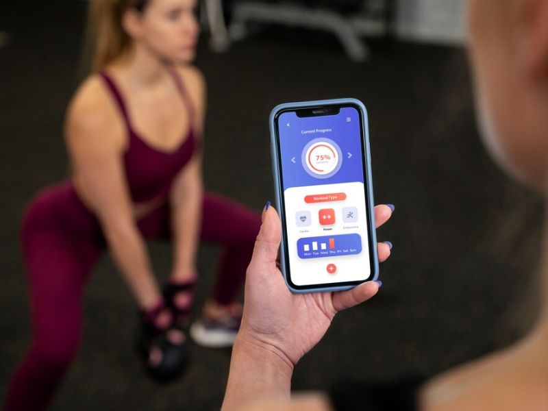 a lady checking his workout in a app