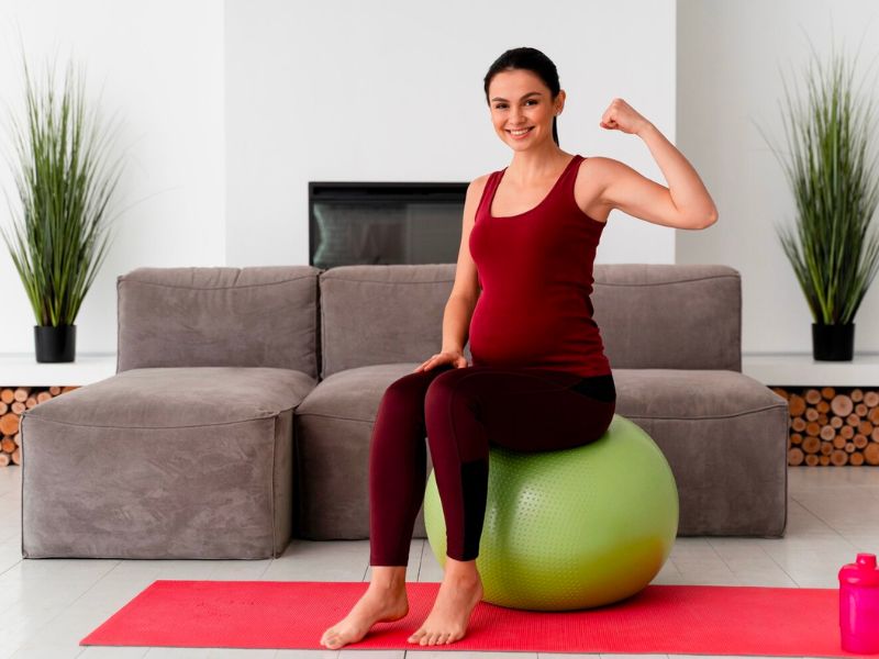 a pregnant women doing workout in a home gym setting  
