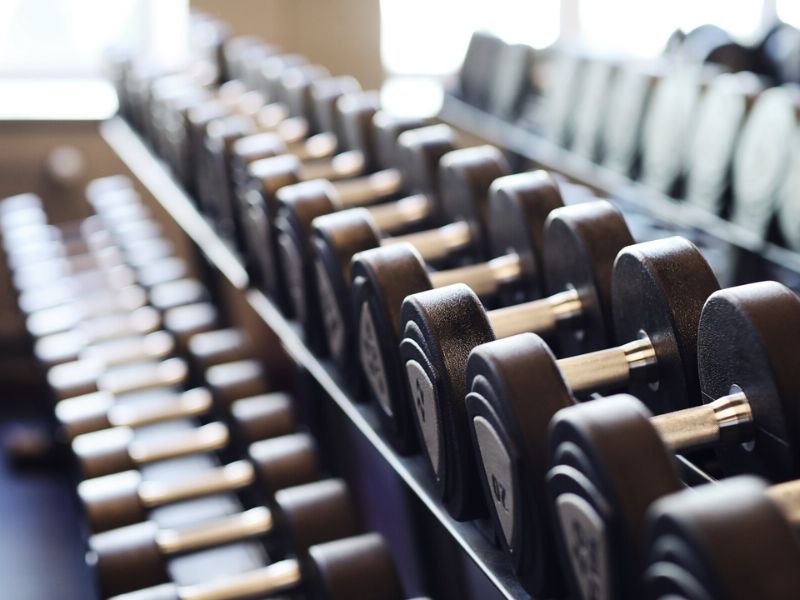 an image showing a rack of dumbbells 