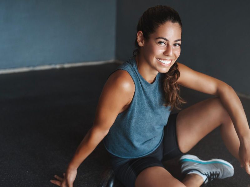 a women smiling after a workout 