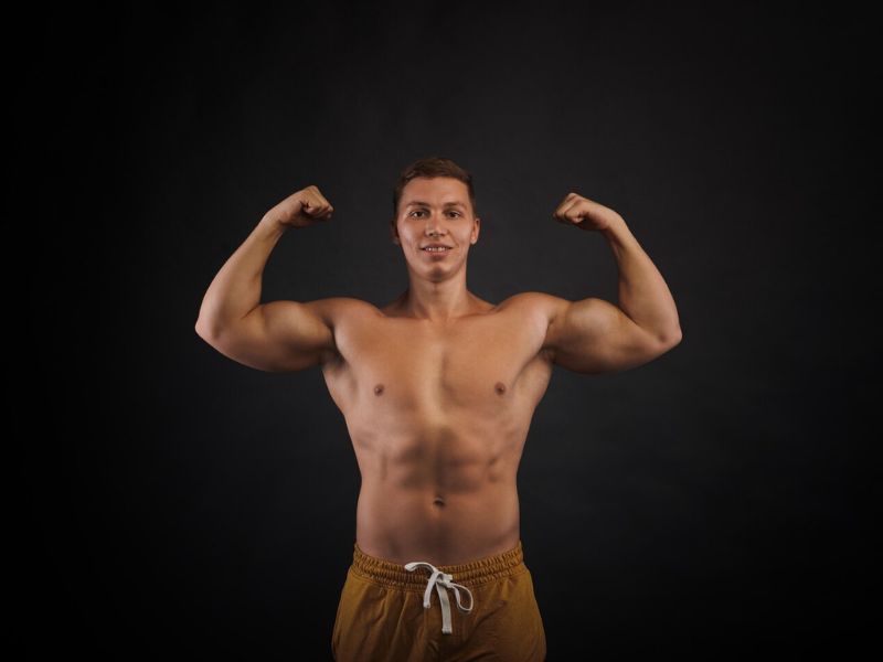 a person showing his muscular body