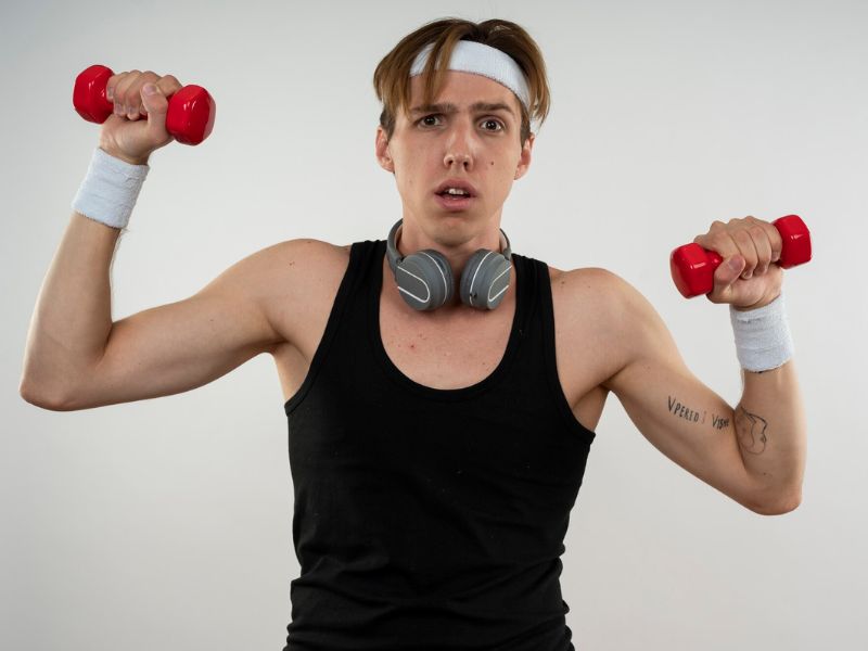 A person looking confused while holding a dumbbell and a question mark.